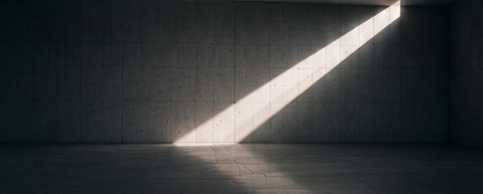 Beam of light in a dark architectural space